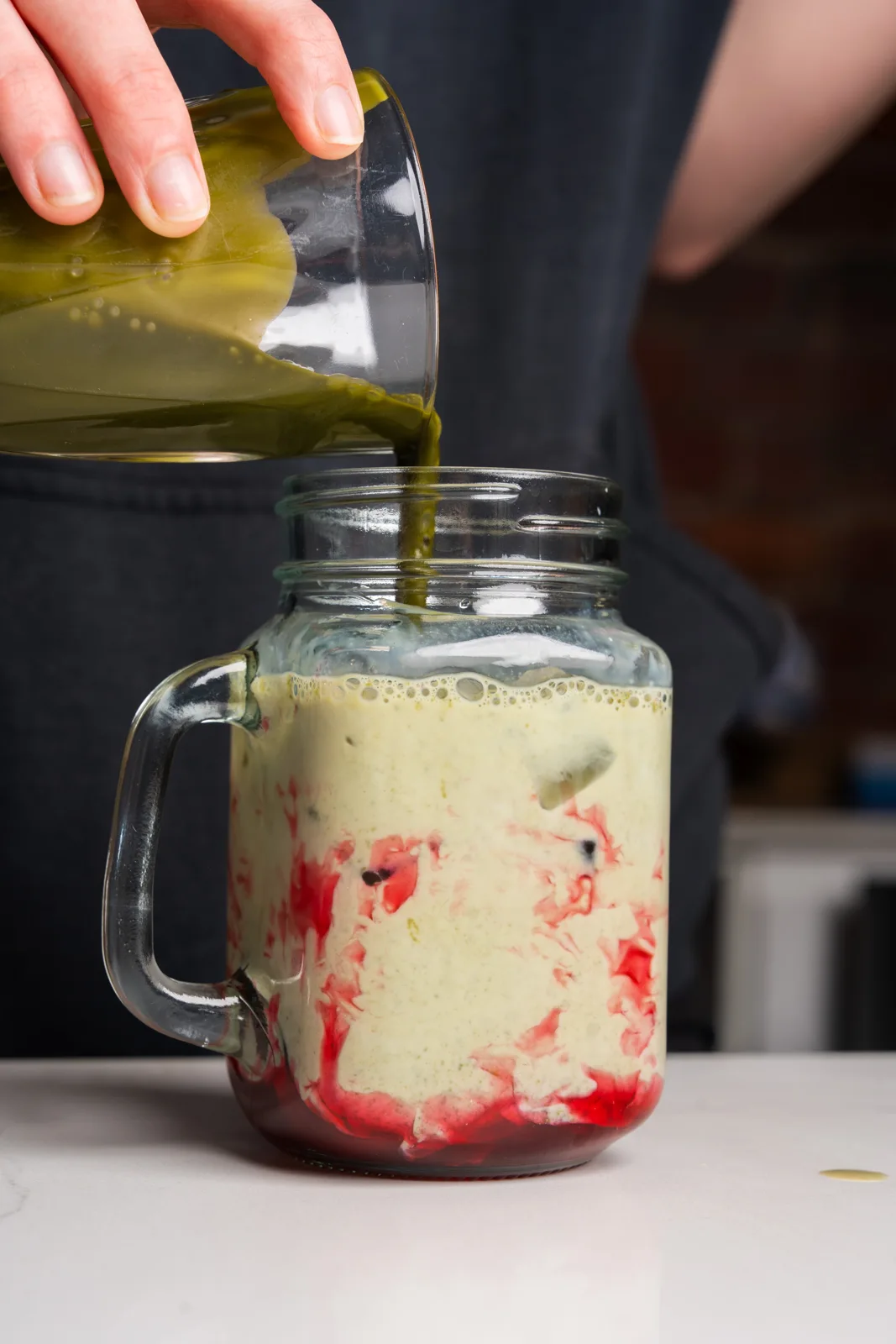 Strawberry matcha being poured